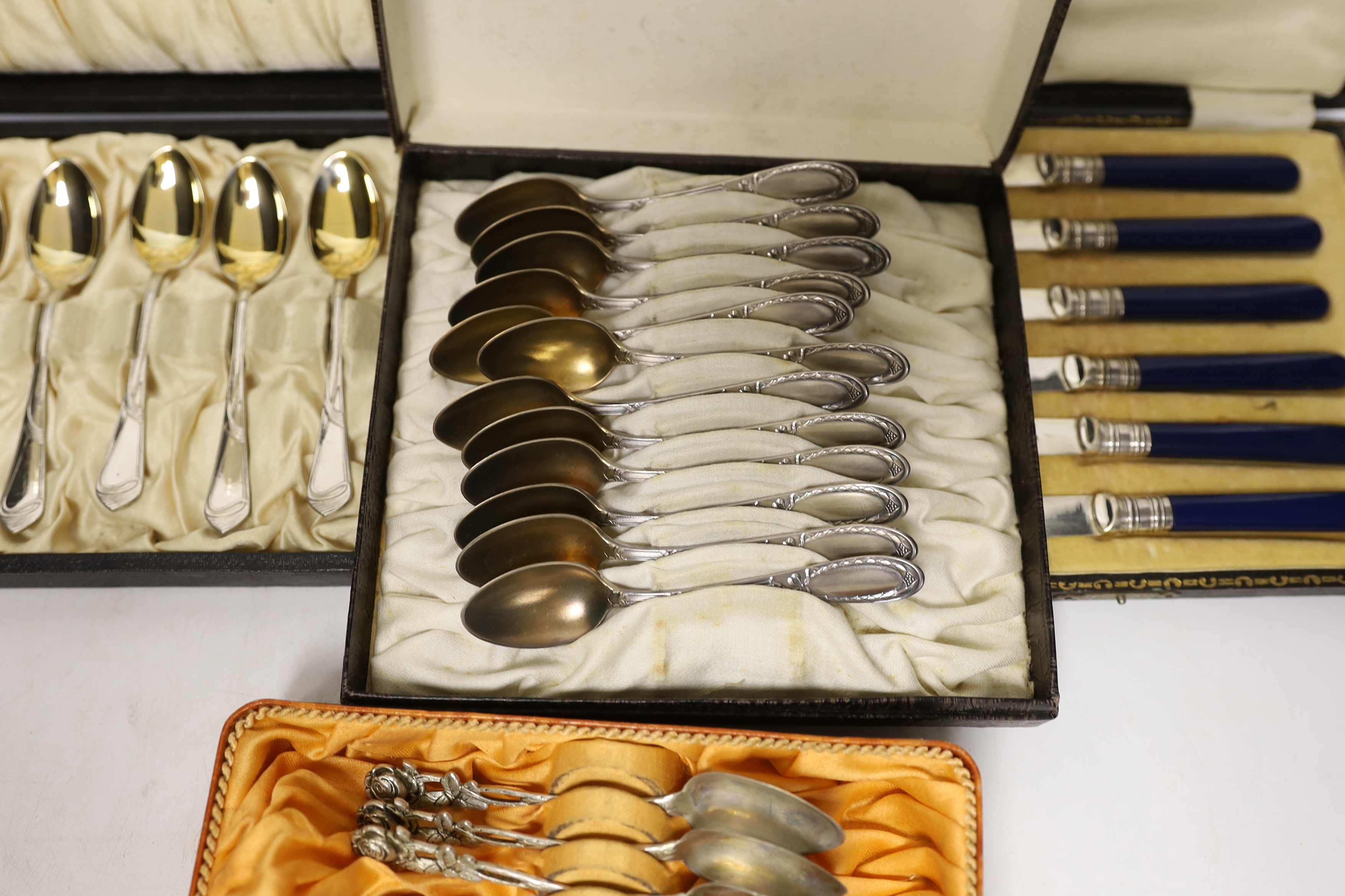 Four cased Continental cutlery sets, one 800 standard